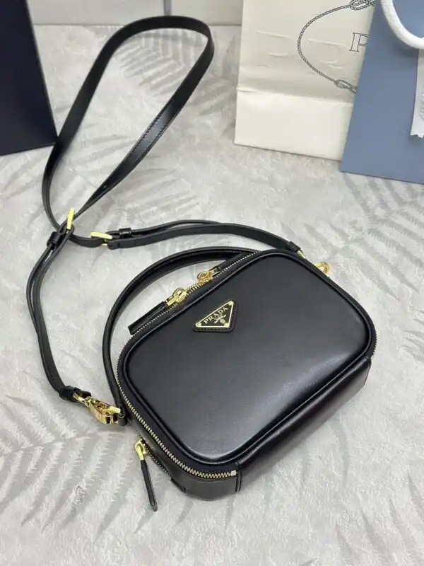 Elevate your style with the charming Prada Mini Top-Handle Bag in classic black. A perfect companion for every moment! 🖤✨👜 https://tinyurl.com/233yompp