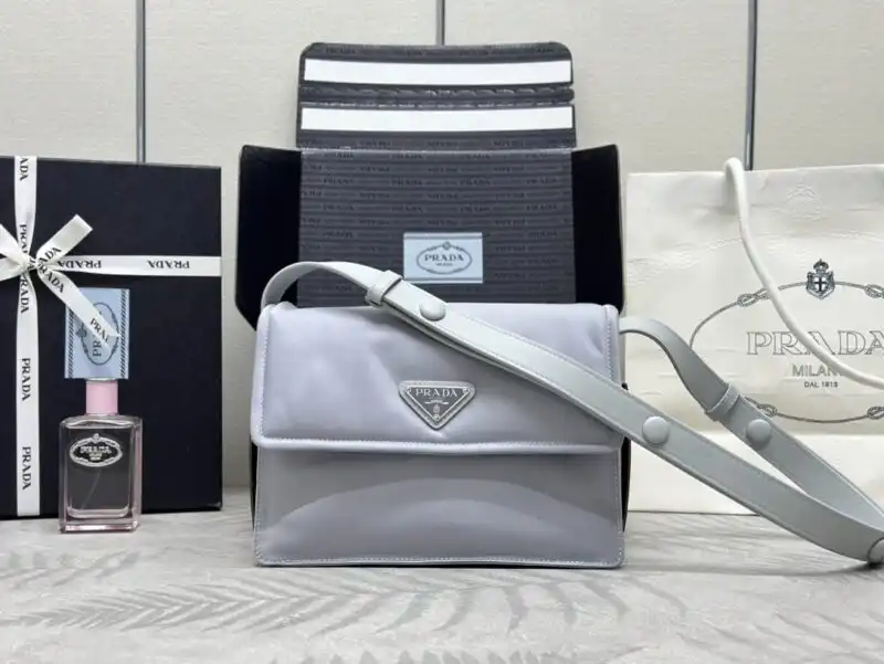 Discover the elegance of the Prada Re-Nylon Shoulder Bag in Ice Grey. A gentle touch of luxury for your everyday style. 💖✨👜 https://tinyurl.com/22afp7xc