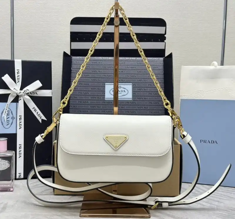 Discover the elegance of the Prada Mini Saffiano in serene white. A timeless accessory that adds a touch of grace to any outfit. 👜✨🌼 https://tinyurl.com/24stnwjw