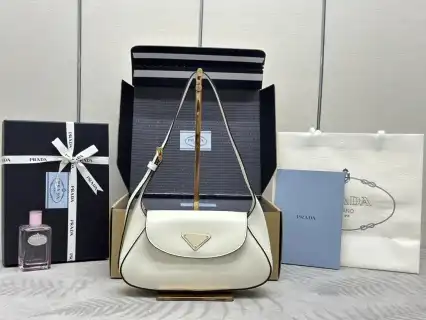 Elevate your style with the elegant Prada Small Shoulder Bag in white. A timeless accessory that perfectly complements any outfit! ✨👜💖 https://tinyurl.com/22ac4p7b