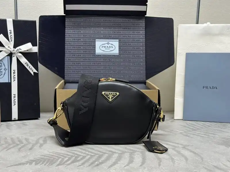 Elevate your style with the elegant Prada Black Mini Shoulder Bag. Perfect for any occasion, it adds a touch of sophistication. 🖤✨👜 https://tinyurl.com/23kqlqy6