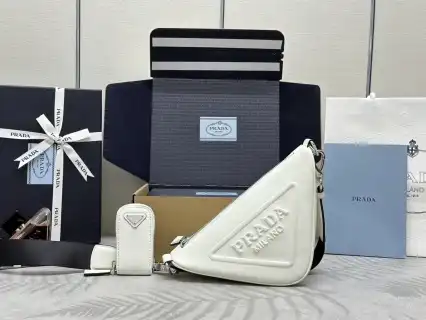 Elevate your style with the timeless elegance of the Prada Saffiano Triangle. A perfect blend of luxury and practicality. ✨💖👜 https://tinyurl.com/23wfbkbb