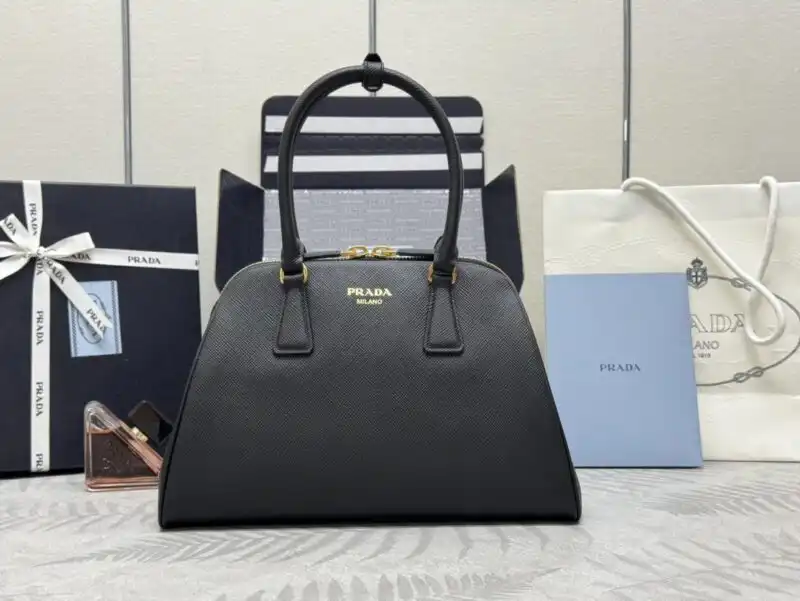 Discover the elegance of the Prada Large Saffiano in classic black. Timeless beauty awaits you! 🌟🖤✨ https://tinyurl.com/25zy5cvv