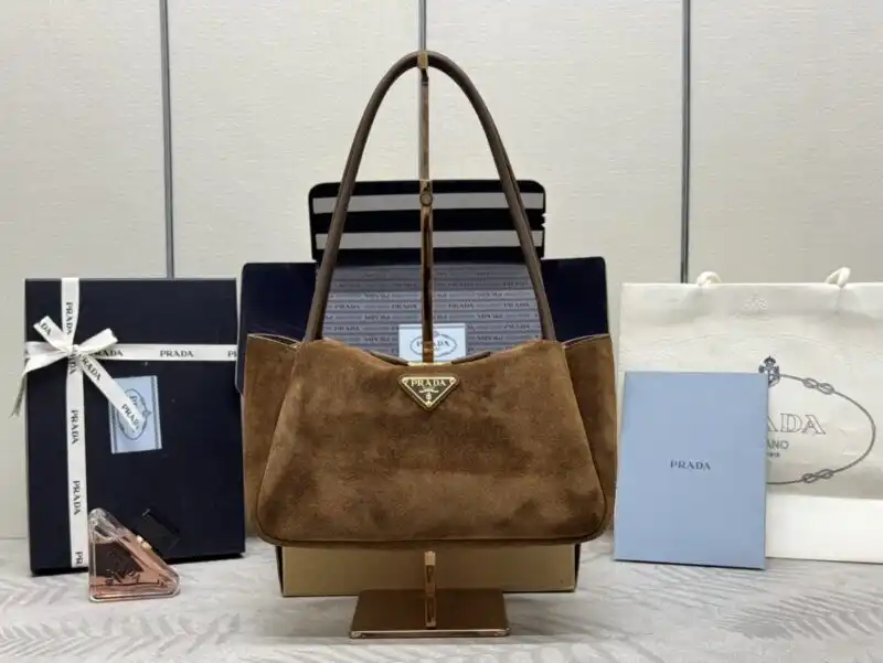 Discover elegance with the Prada Medium Suede Shoulder Bag, a gentle touch of luxury for your everyday adventures. 🌟👜❤️ https://tinyurl.com/24w7xnw5