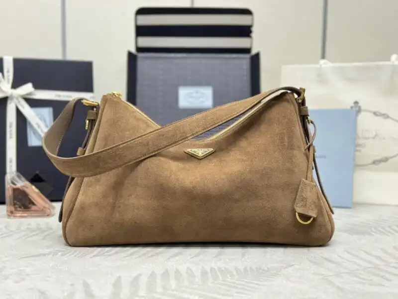 Discover the elegance of the Prada Aimée Suede Large, where timeless style meets luxurious comfort. Treat yourself to beauty! ✨💖👜 https://tinyurl.com/26gm9j5q