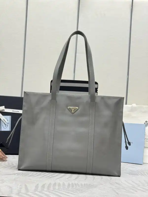 Discover the timeless elegance of the Prada Antique Nappa Tote in soft grey. A perfect blend of style and sophistication! 🌟👜✨ https://tinyurl.com/2yy6tr34