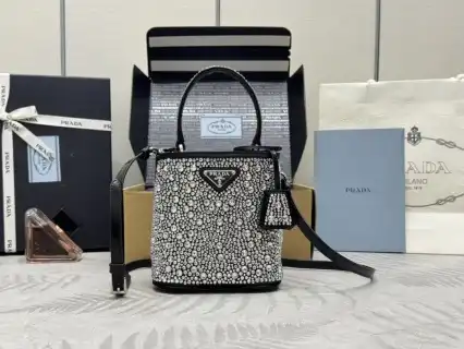 Discover elegance with the Prada White Crystal Bucket Bag ✨💖—a perfect blend of luxury and charm for your everyday adventures! 🌟👜 https://tinyurl.com/28uv4x4q