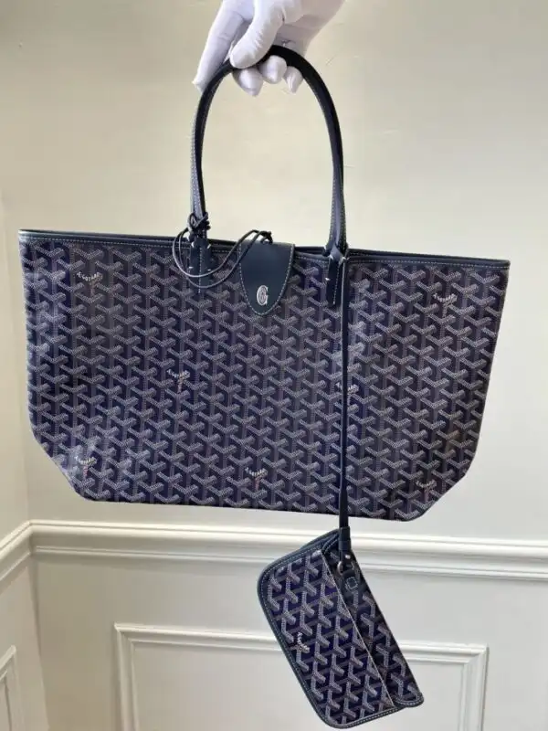 Discover elegance with the Goyard Saint Louis in Dark Blue. A timeless companion for your adventures, blending style and grace effortlessly. 💙✨👜 https://tinyurl.com/2547jck4