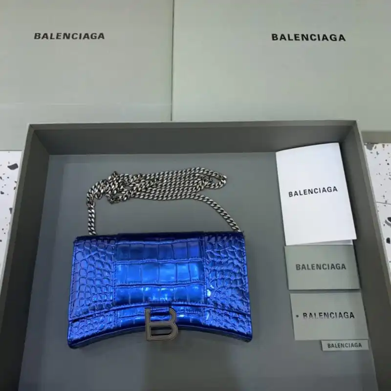 Discover the elegance of the Balenciaga Hourglass On Chain in serene blue. A timeless accessory to elevate your style. 💙✨👛 https://tinyurl.com/238ek6os