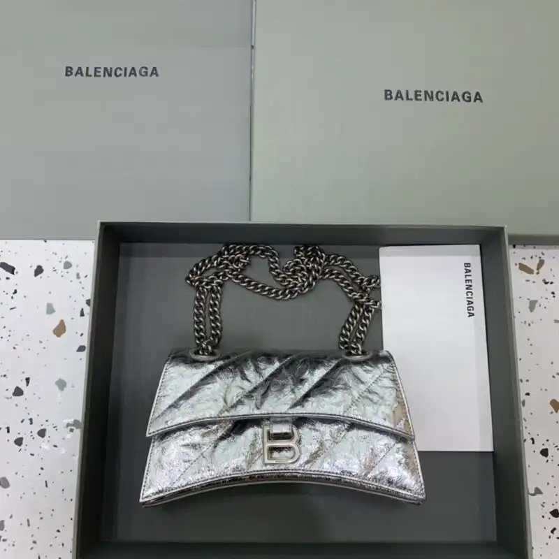 Discover the elegance of the Balenciaga Crush Small in Silver. A timeless accessory that adds grace to any outfit. ✨💖 https://tinyurl.com/22yfrnw3