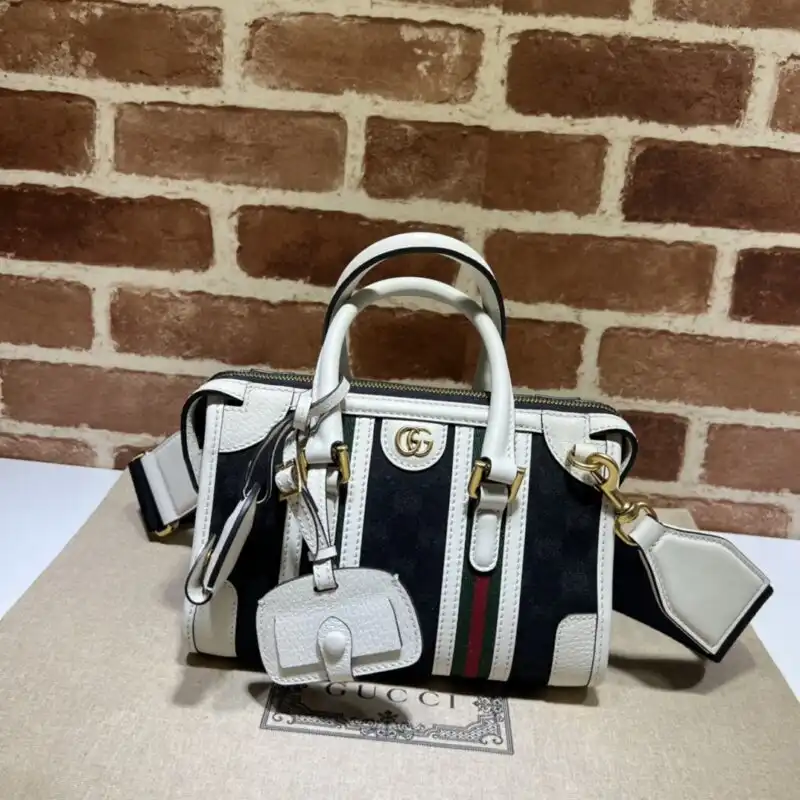 Discover elegance with the Gucci Bauletto Top Handle in timeless white and black. A beautiful addition to your collection! 🌟👜✨ https://tinyurl.com/2dkpje75