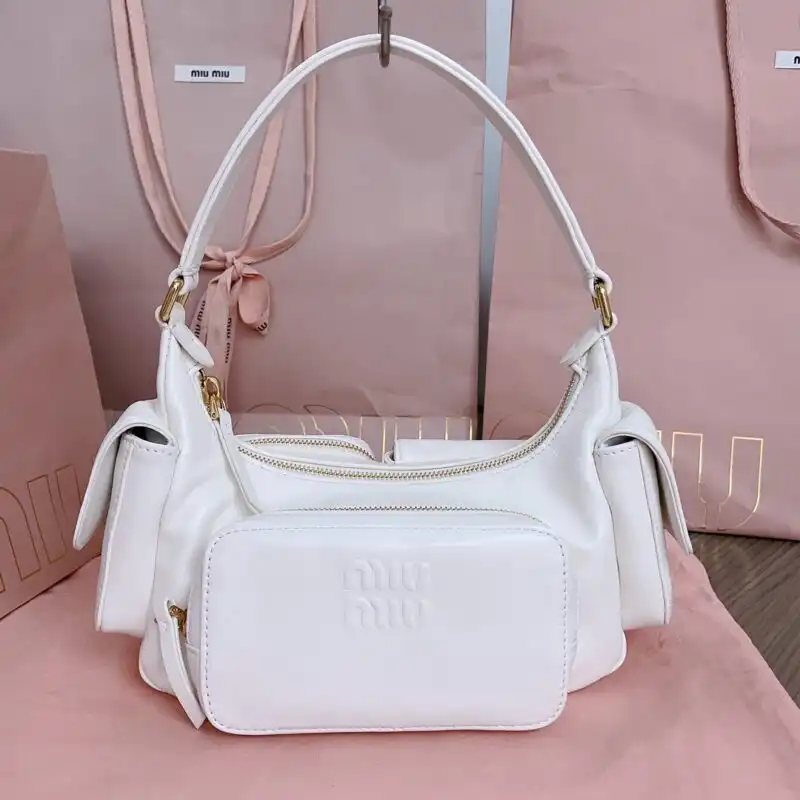 Discover the elegance of the Miu Miu Nappa Pocket Bag in white. A perfect blend of style and charm! ✨🤍👜 https://tinyurl.com/22szohnn