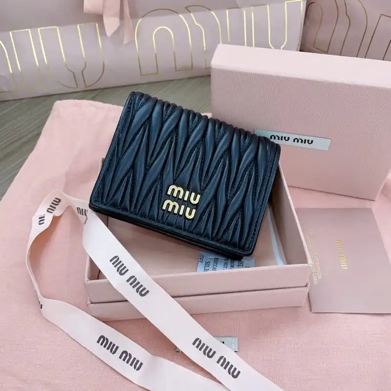 Discover the elegance of the Miu Miu Pocket Wallet in timeless black. A perfect blend of style and functionality! 🖤✨💫 https://tinyurl.com/23vajkc8