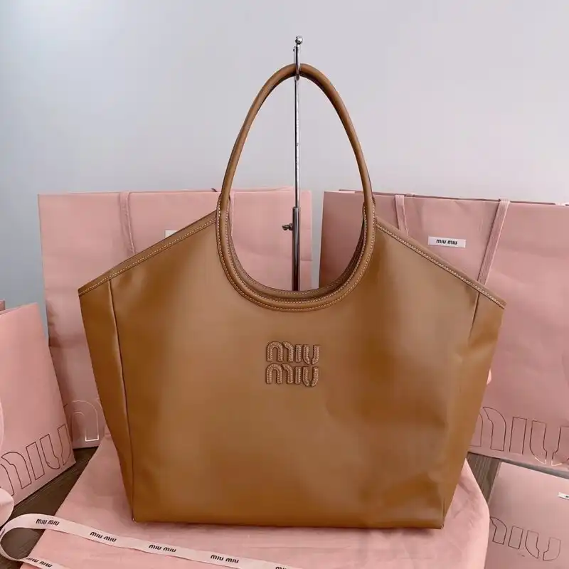 Discover the Miu Miu Ivy Tote in warm brown—a perfect blend of elegance and charm, perfect for your daily adventures. 🌼👜✨ https://tinyurl.com/2yze3njp