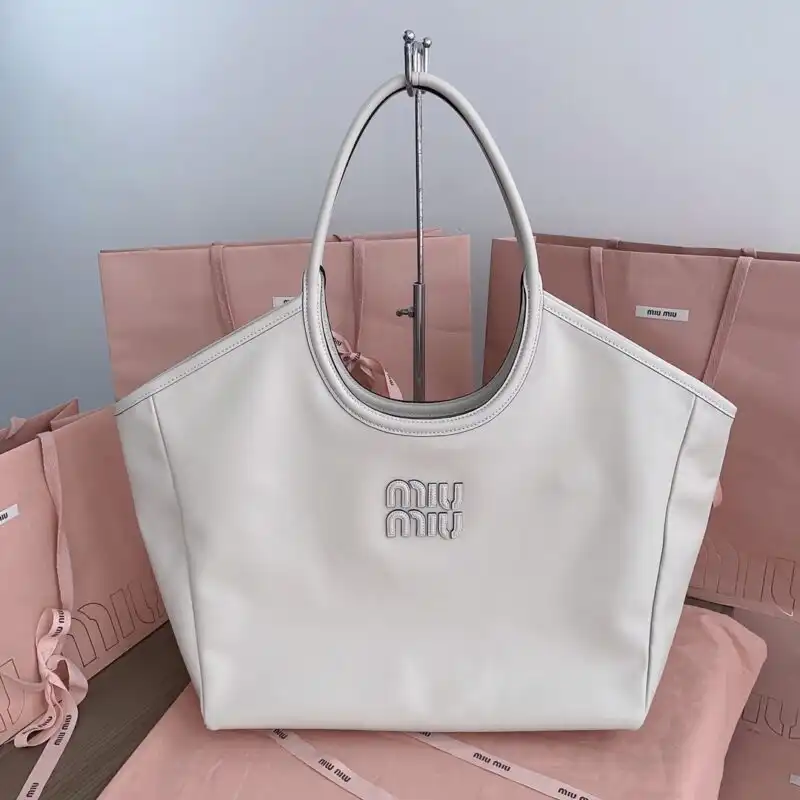 Discover the Miu Miu Ivy Tote in serene white—your perfect companion for elegance and charm. 🌼✨ Embrace beauty with every carry! 👜💖 https://tinyurl.com/274ytalv