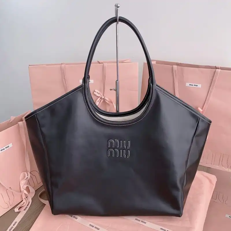 Introducing the Miu Miu Ivy Tote in elegant black 🌟 – a perfect blend of style and functionality to elevate your look! 🖤✨ https://tinyurl.com/2yt777d7