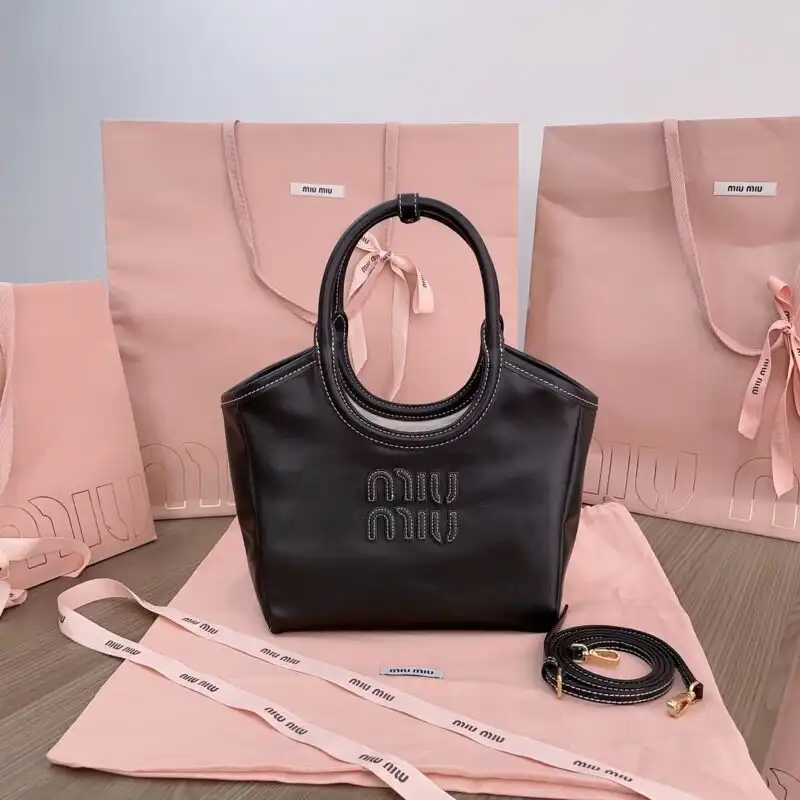 Discover the elegance of the Miu Miu Ivy Small Tote in classic black—your perfect companion for every occasion. 🖤✨👜 https://tinyurl.com/27x77z4s