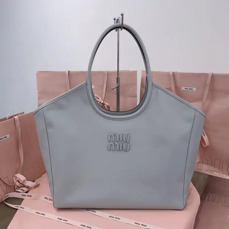 Discover the elegance of the Miu Miu Ivy Tote in soothing grey, a perfect blend of style and grace. 🌼👜✨ https://tinyurl.com/27j3bskf