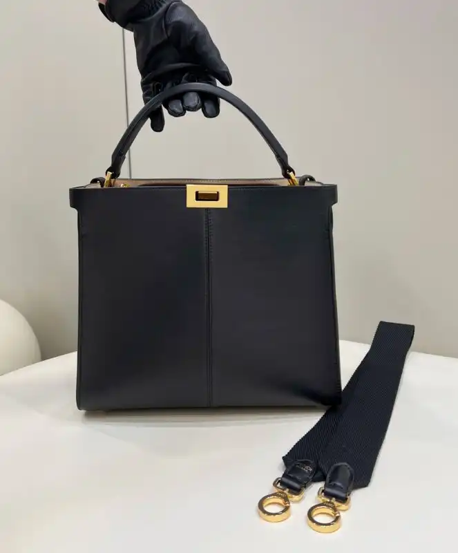 Discover the elegance of the Fendi Peekaboo X Lite in timeless black. A perfect companion for your stylish journey! 🖤✨🌟 https://tinyurl.com/246d3ra8