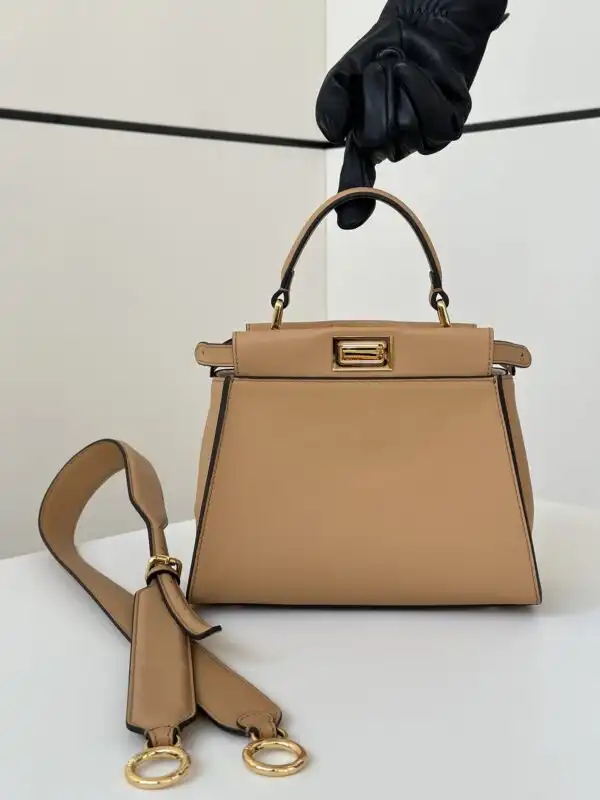 Discover the elegance of the Fendi Peekaboo Large in soothing light brown. A timeless companion for every occasion. 👜✨💖 https://tinyurl.com/279qabx8