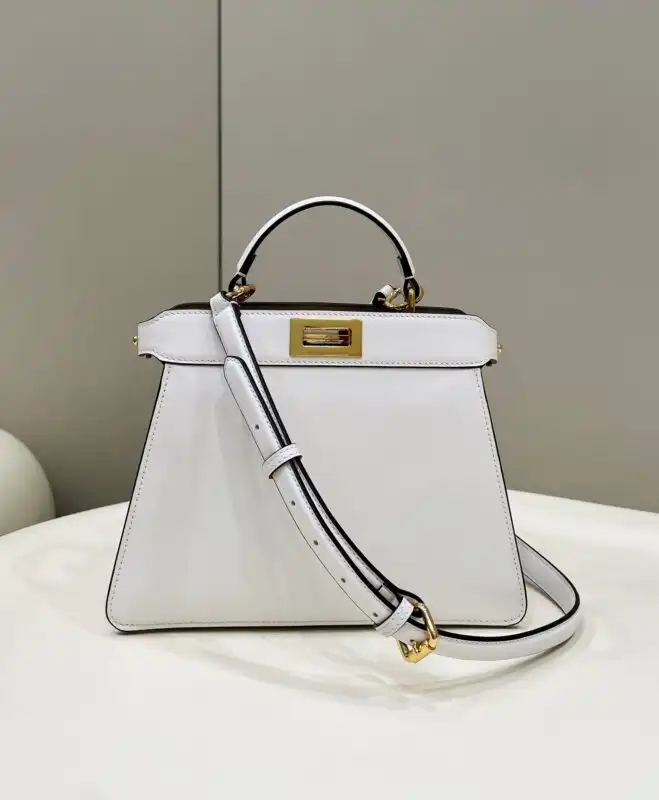Discover the elegance of the Fendi Peekaboo Medium in pristine white. A timeless piece that adds a touch of grace to any outfit. 🌸✨👜 https://tinyurl.com/22y9jjun