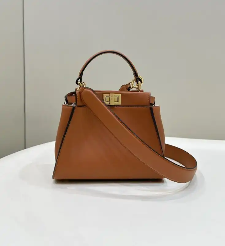 Discover the timeless elegance of the Fendi Peekaboo Medium in a warm brown hue. Perfect for adding a touch of luxury! 👜✨💖 https://tinyurl.com/233x97a7