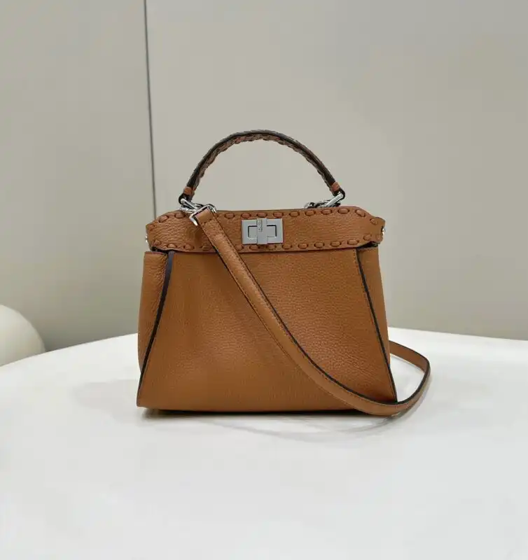 Discover the elegance of the Fendi Peekaboo Small in rich brown. A timeless piece that adds warmth to your style. 💖👜✨ https://tinyurl.com/2bxxqmmm