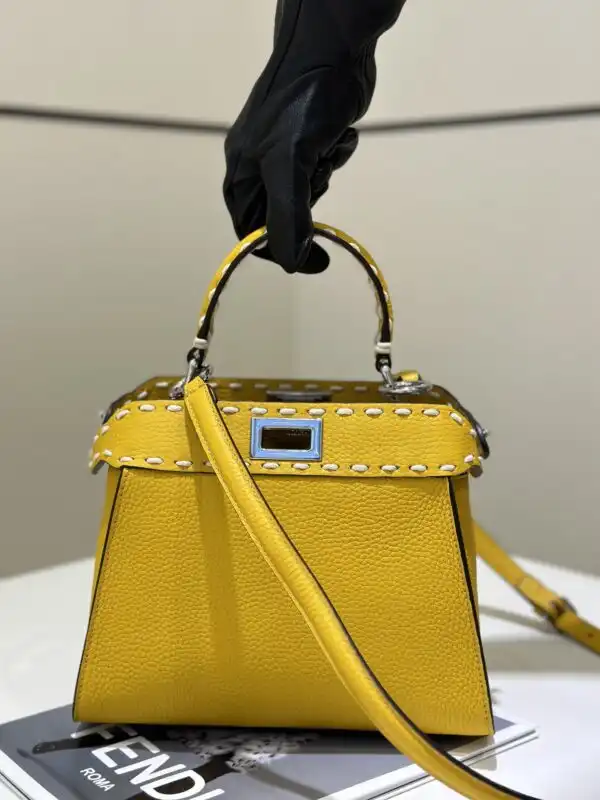 Discover the charming Fendi Peekaboo in sunny yellow! 🌼✨ A timeless piece that brightens your style with elegance and joy. 💛👜 https://tinyurl.com/2c83jpbp