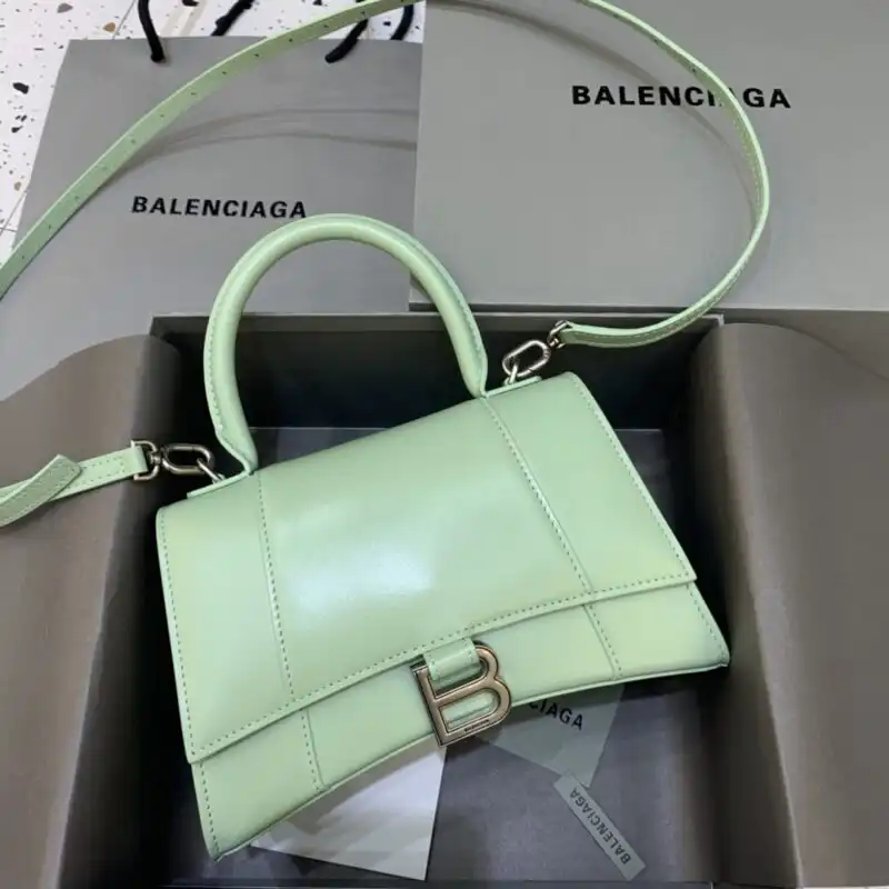 Embrace elegance with the Balenciaga Hourglass in soothing green. A perfect blend of style and grace awaits you! 💚✨👜 https://tinyurl.com/259vlz8b