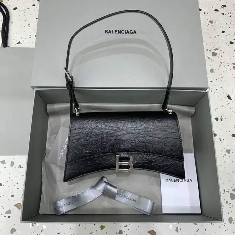 Discover the elegance of the Balenciaga Crush Small in black and silver. Perfect for any occasion, it’s a true statement piece! 🖤✨👜 https://tinyurl.com/2yn599j5