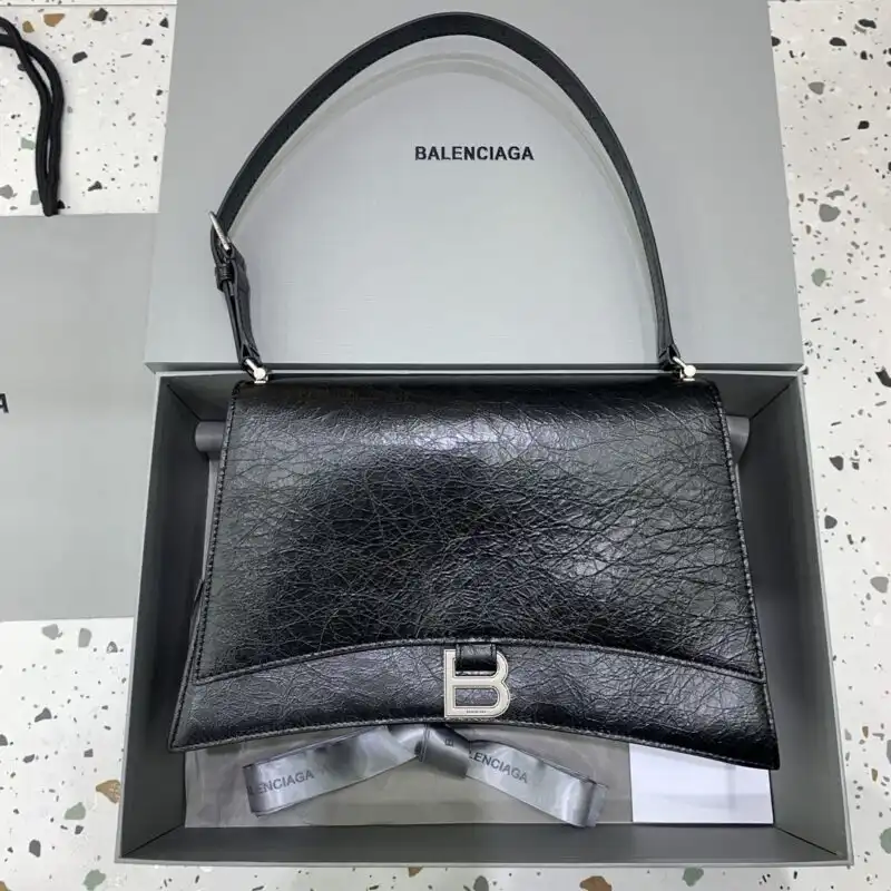 Introducing the Balenciaga Crush Large in timeless black and elegant silver. A perfect blend of style and sophistication. ✨🖤💫 https://tinyurl.com/2ympoanu