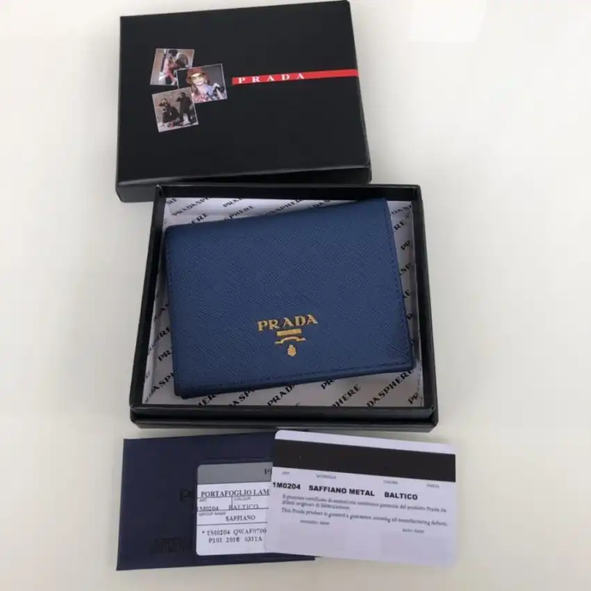Embrace elegance with the Prada Saffiano Two Fold Wallet in serene blue. It’s a perfect blend of style and functionality. 💙✨ https://tinyurl.com/2ao6wv7p