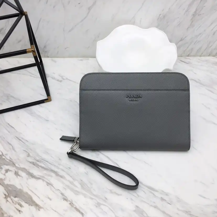 Discover the elegance of the Prada Saffiano New Pouch in soothing grey. Perfect for any occasion. 💖✨ Treat yourself! 🌸👜 https://tinyurl.com/28aloaxu