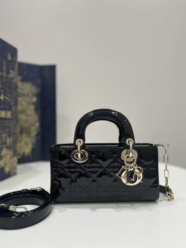 Introducing the Dior Lady D-Joy Bag in Patent Black 🌟✨ A timeless piece that adds elegance and charm to any outfit. 💖👜 https://tinyurl.com/25ng672c