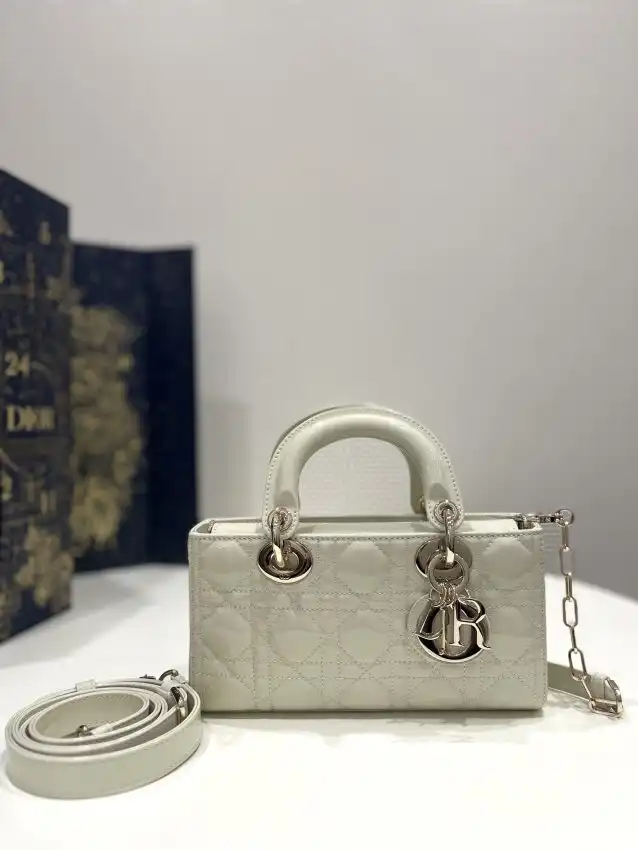 Discover elegance with the Dior Lady D-Joy Bag in White Patent. A timeless accessory that adds a touch of luxury to every outfit. ✨👜💖 https://tinyurl.com/287bcn28