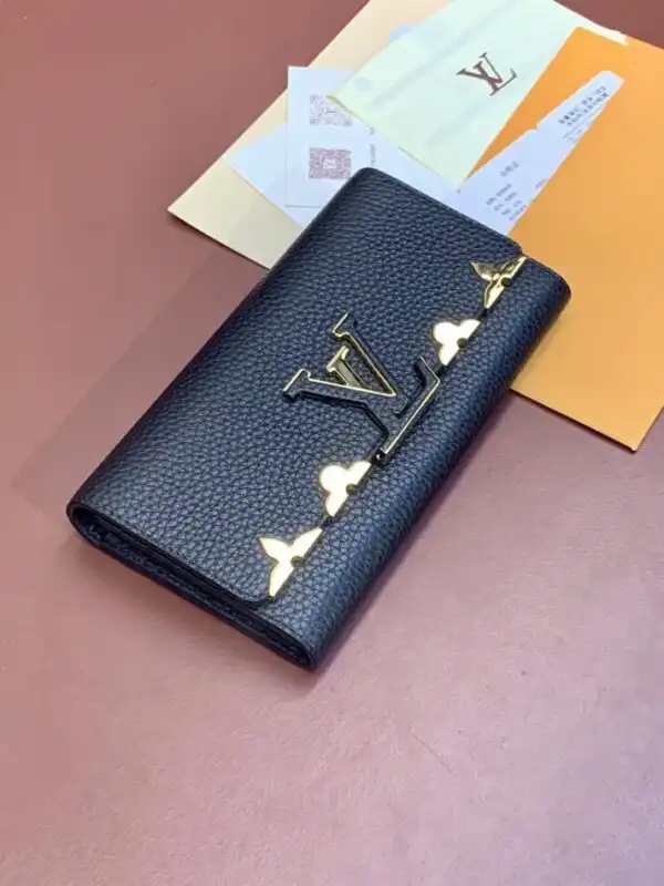 Discover the elegance of the Louis Vuitton Capucines Long in timeless black. A perfect blend of luxury and sophistication. ✨🖤🌟 https://tinyurl.com/2xnqqg93