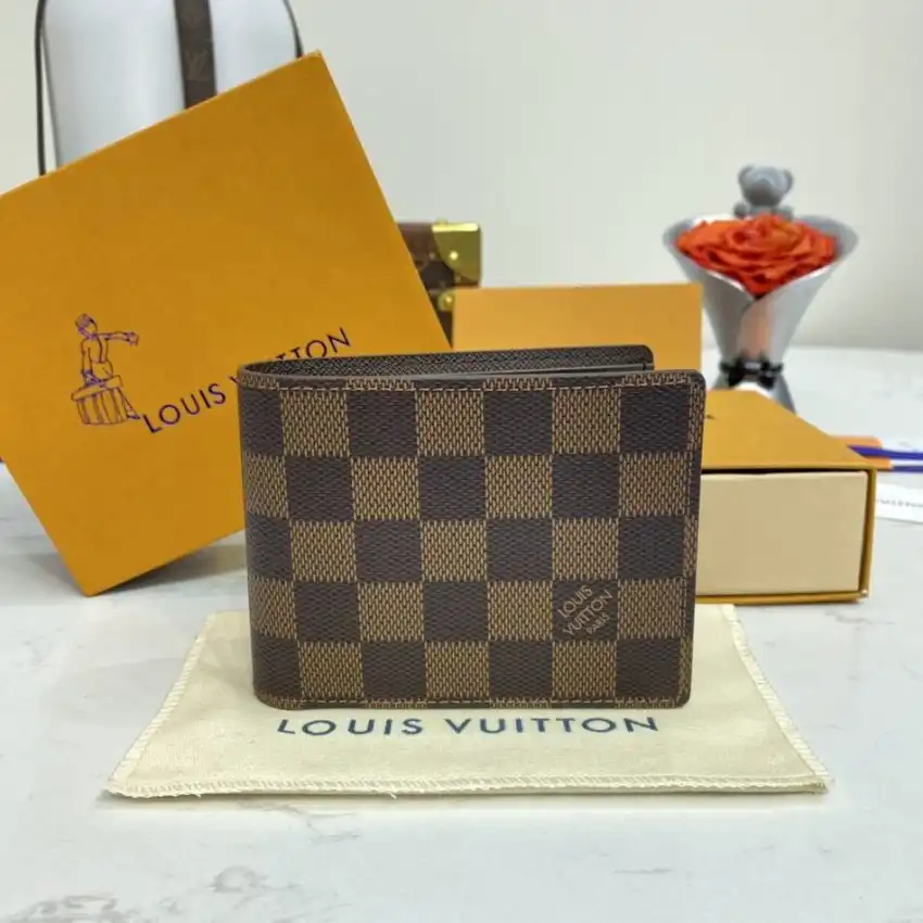 Discover elegance with the Louis Vuitton Multiple Wallet in a timeless brown grid. Perfectly crafted for your essentials. 💖✨👜 https://tinyurl.com/28jmrmdo