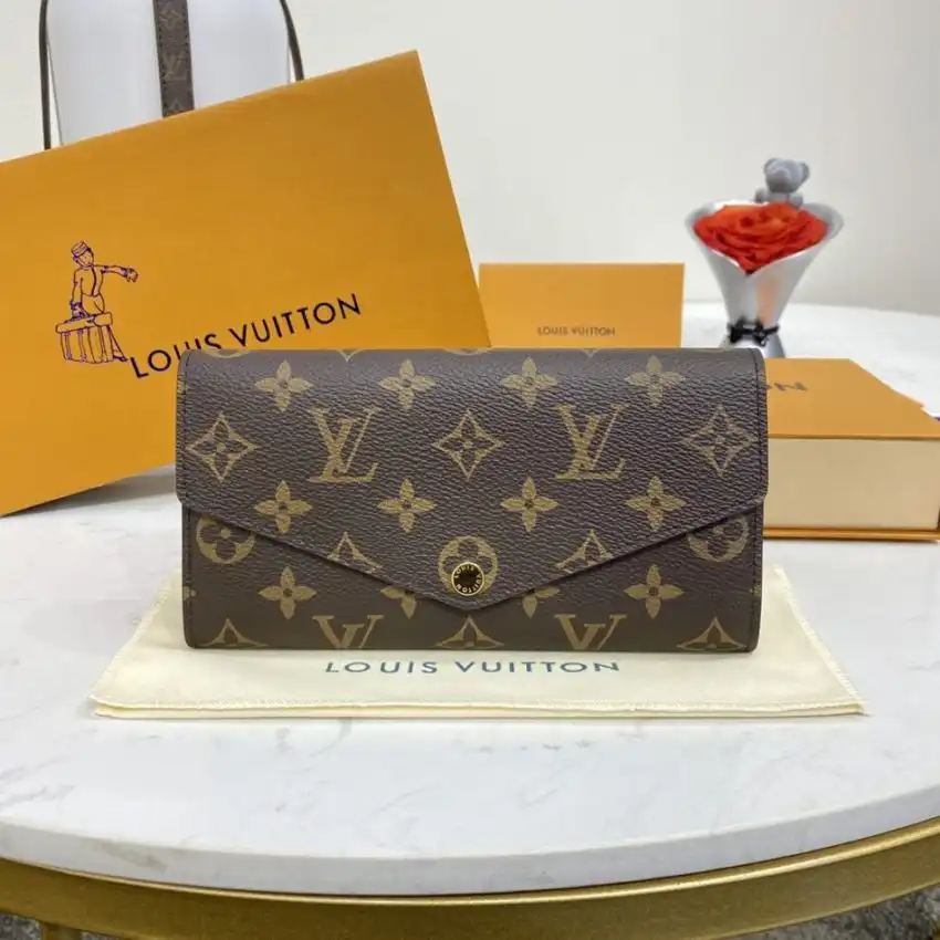 Discover the elegance of the Louis Vuitton Sarah Wallet in rich brown. A timeless companion for your essentials. 💖✨👜 https://tinyurl.com/22gh6v2t