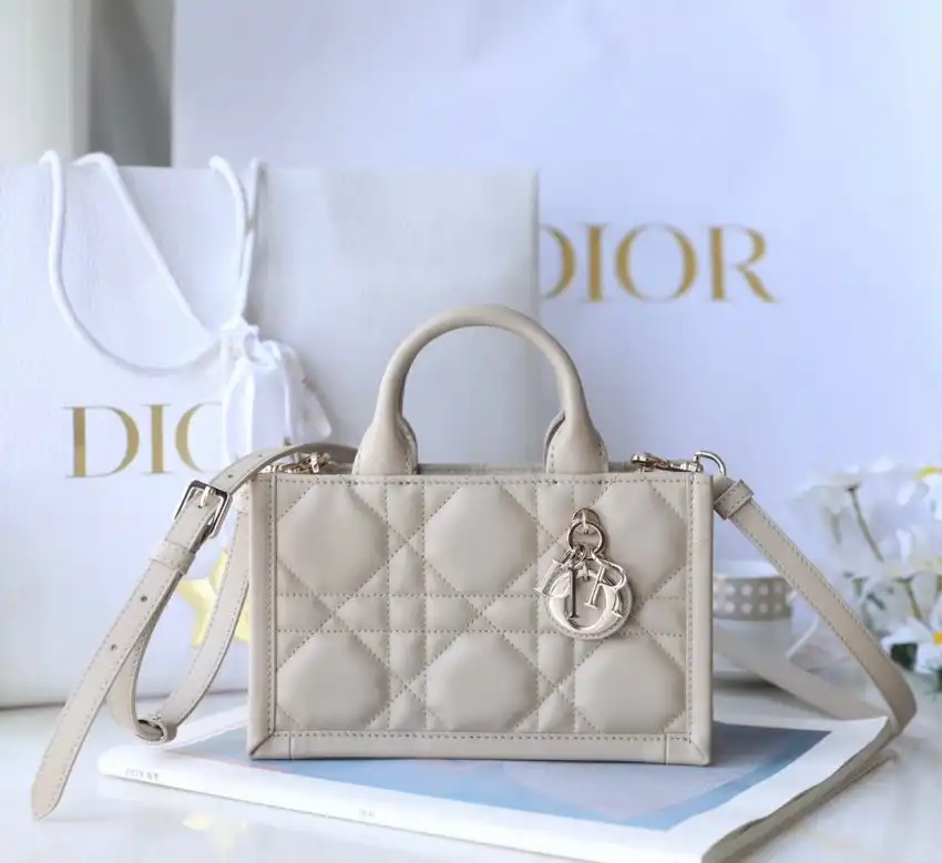 Elevate your style with the Dior Tote Book Mini in soft beige. A perfect blend of elegance and charm! 🌼✨👜 https://tinyurl.com/2b3efewe