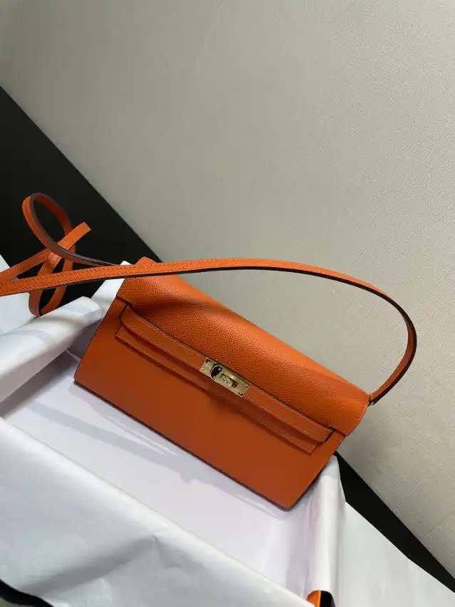 Introducing the enchanting Hermes Kelly Elan in vibrant orange! A timeless piece that radiates warmth and elegance. 🍊✨💕  https://tinyurl.com/25mw7zd6