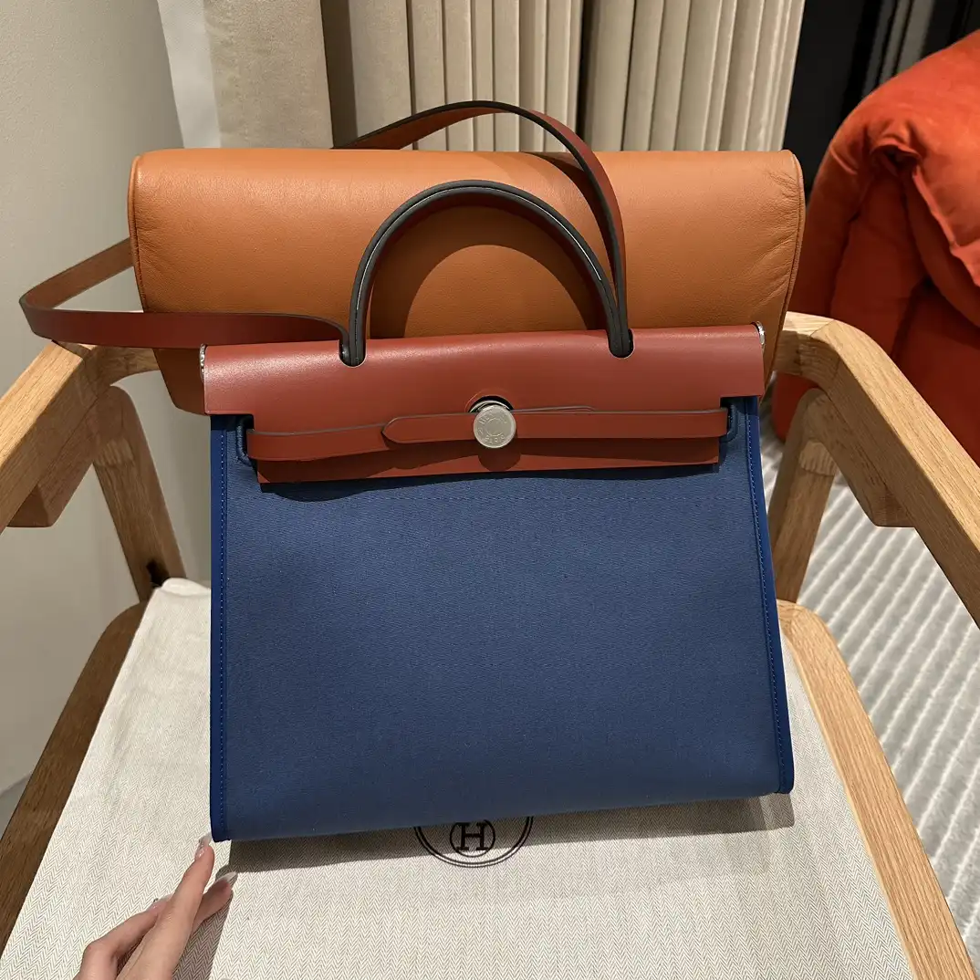 Discover the elegance of the Hermes Herbag 31cm in soothing blue canvas. A timeless companion for your daily adventures! 💙👜✨ https://tinyurl.com/2autkfhe