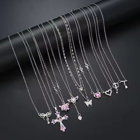 9 Pcs Women’s Elegant Zircon Pendants Necklace Set Fashion Pink Color Cross Butterfly Heart Bowknot Necklaces Party Jewelry Gift https://tinyurl.com/27tajxdp
