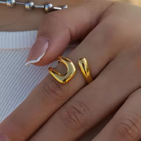 Uworld Stainless Steel Geometric Hollow Layered Wide Ring Metal Texture Waterproof Daily Simple Stylish Golden Jewelry for Women https://tinyurl.com/26kvohqb